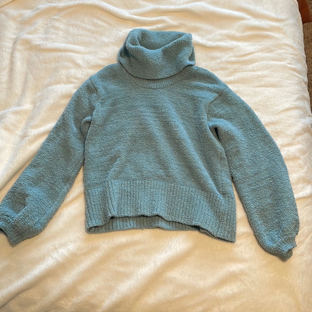 Light blue, turtle neck sweater. Made by Ruby Moon.